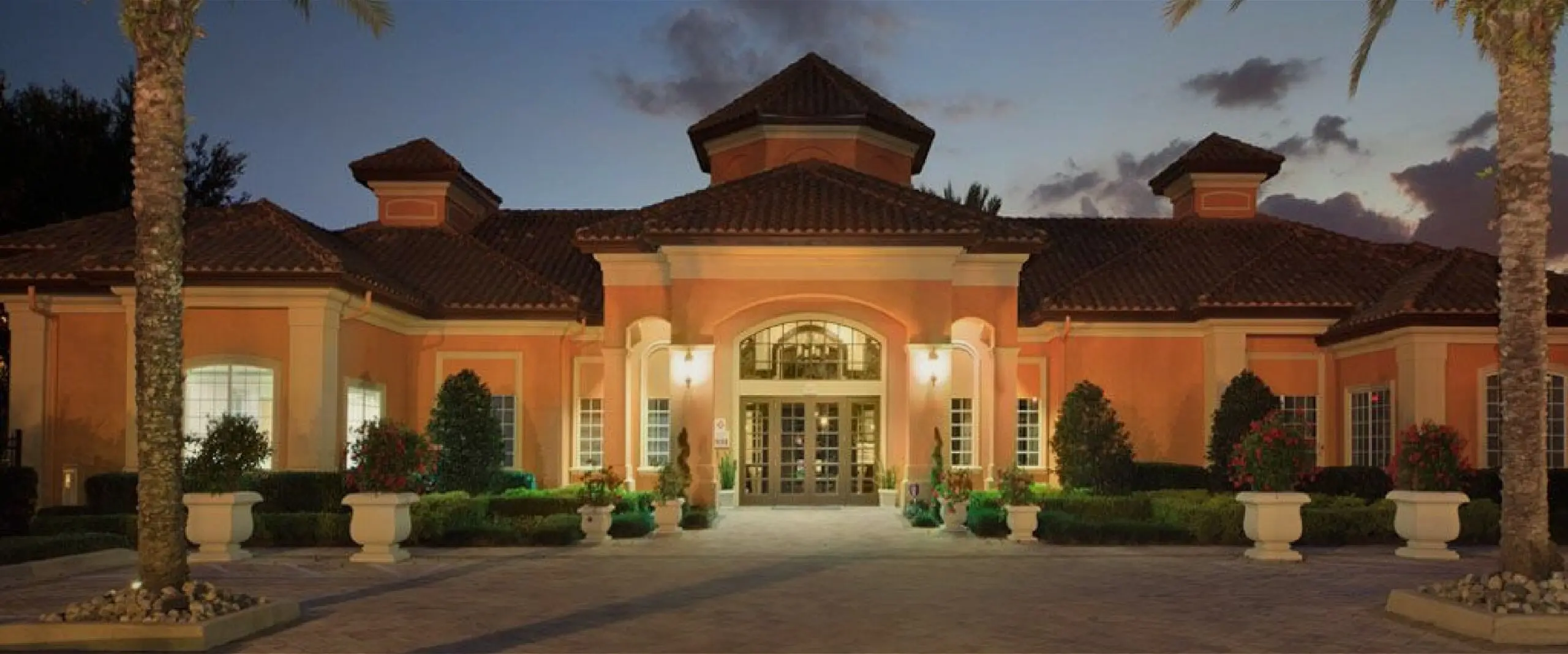 The entrance to the Metro West clubhouse at dusk.