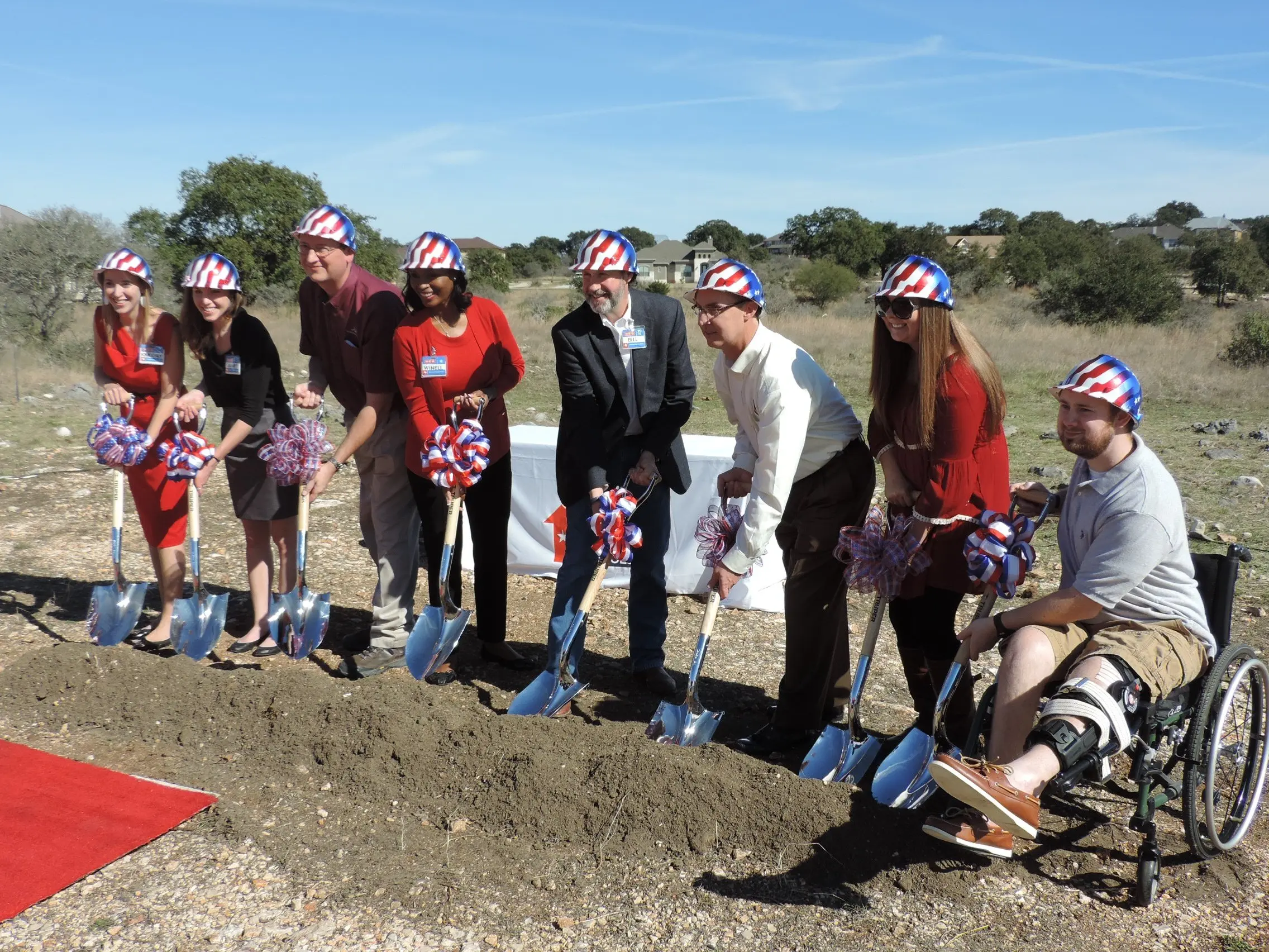 A group of people with shovels at a Veteran home site donated by Southstar.