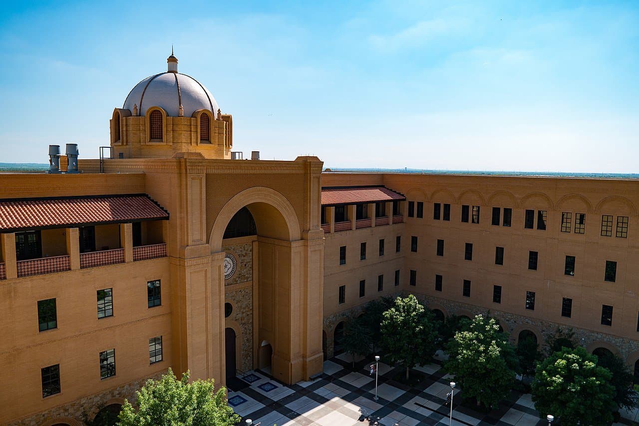 An aerial view of a tan building with a dome at Texas A&M University in San Antontio.