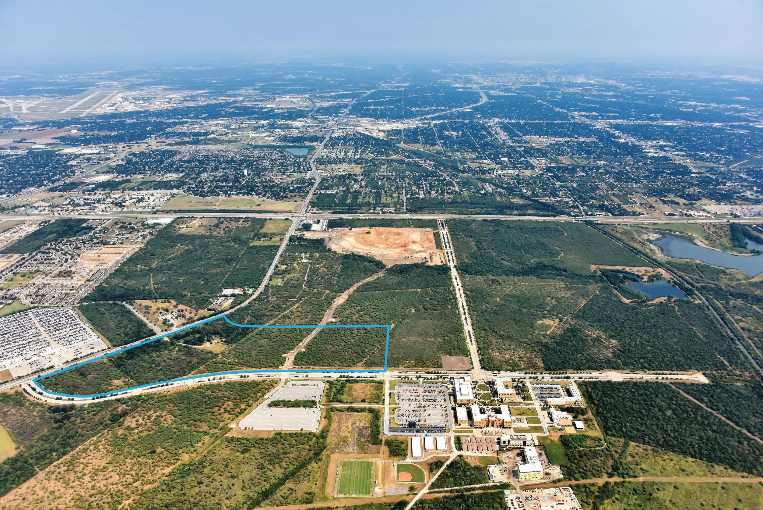 An aerial view with a blue outline of the Vida hospital site