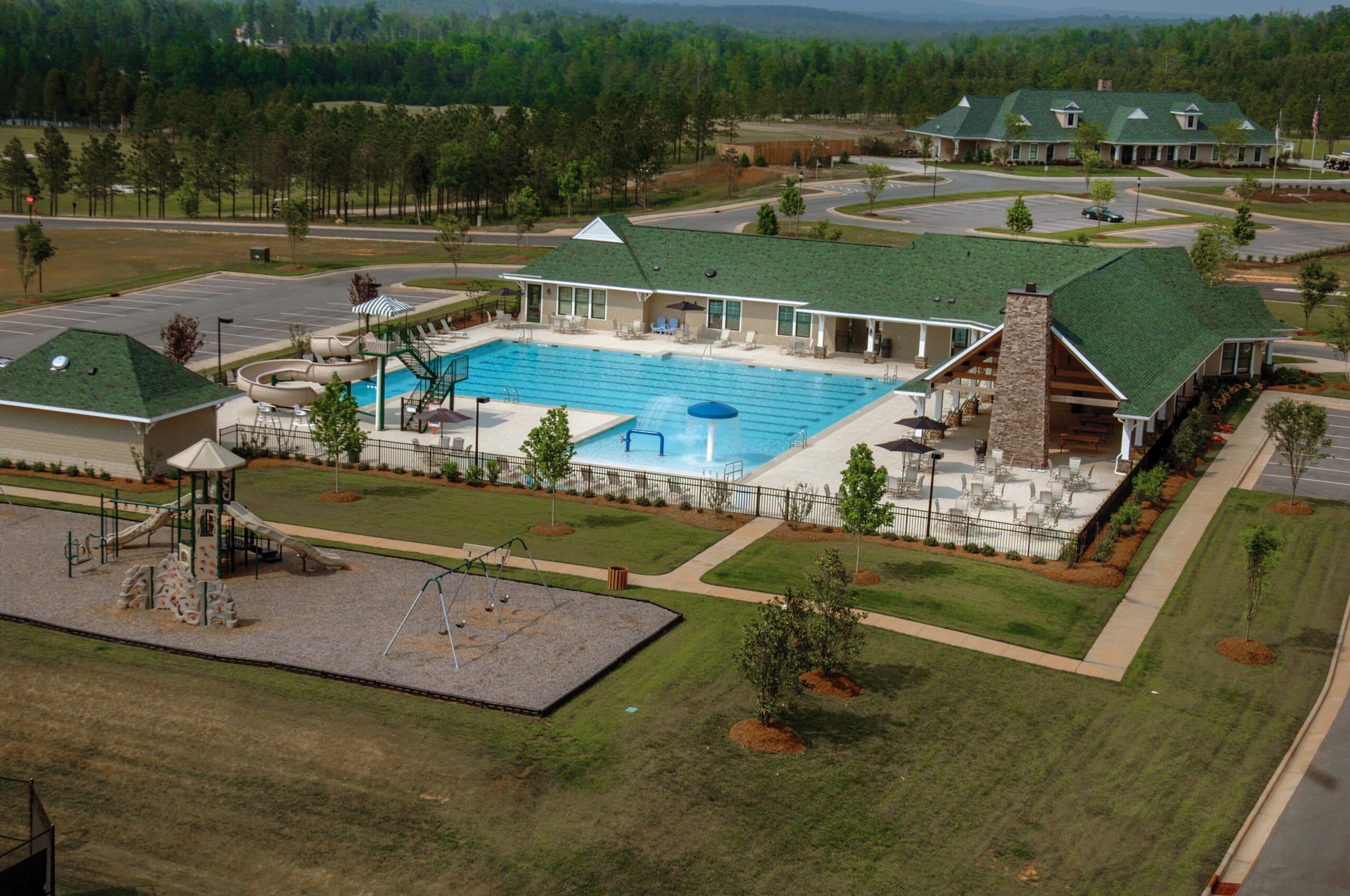 An aerial view of a swimming pool and playground at Chapel Ridge